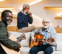 three old men playing musical instruments